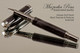 Handmade Rollerball Pen from Antique Swirl Resin Black Titanium/Rhodium finish.  Main view of pen.