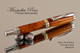 Hand Made Rollerball Pen made from Cherry Burl with Chrome finish and Gold highlights. 