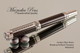 Handmade Rollerball pen made from Carbon Fiber / Resin with Rhodium / Black Titanium finish.   Stock Picture