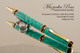 Handcrafted Ballpoint pen made from Turquoise TruStone with  Gold & Black finish.  Black Web and Three Ring accents.