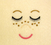 Embroidered Doll Face with Freckles Embroidery Machine Design