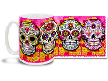 Bright and fun pink theme, pretty flowers and four different vivid sugar skulls make this Day of the Dead skull mug a keeper! 15oz skulls coffee mug is durable, dishwasher and microwave safe.