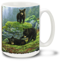 Playful bear cubs are as cute as can be in this beautiful forest scene.