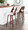 Cecina Mid-Century Modern Counter Stool with Swivel in Mahogany and White Faux Leather- Set of 2 — lifestyle photo 3