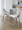 Charlotte 24" Farmhouse Fixed-Height Counter Stool with Swivel in Light Grey Wood and Cream Fabric with Round Chrome Metal Footrest- Set of 2 — lifestyle photo 2