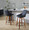 Diana 24" Contemporary Fixed-Height Counter Stool with Swivel in Walnut Wood and Black Faux Leather with Round Black Metal Footrest- Set of 2 — lifestyle photo 1