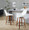 Diana 24" Contemporary Fixed-Height Counter Stool with Swivel in Walnut Wood and White Faux Leather with Round Black Metal Footrest- Set of 2 — lifestyle photo 2