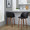 Fran 24" Mid-Century Modern Fixed-Height Counter Stool with Swivel in Walnut Wood and Black Faux Leather with Round Chrome Metal Footrest- Set of 2 — lifestyle photo 1