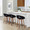 Grotto Upholstered 24" Contemporary Fixed-Height Counter Stool with Swivel in Walnut Wood and Black Velvet with Round Black Metal Footrest- Set of 2 — lifestyle photo 2