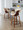 Curvo counter stool in Walnut Wood, Cream PU, Black Metal, featuring swivel and wood frame