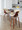 Curvo counter stool in Walnut Wood, Cream PU, Chrome Metal, featuring swivel and wood frame