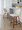 Toriano Mid-Century Modern Fixed-Height Counter Stool in Walnut Wood and Cream Fabric with Square Black Metal Footrest- Set of 2 — lifestyle photo 1