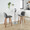 Toriano 24" Mid-Century Modern Fixed-Height Counter Stool with Swivel in Walnut Wood and Grey Faux Leather with Round Chrome Metal Footrest- Set of 2 — lifestyle photo 1