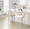 Charlotte 26" Farmhouse Fixed-Height Counter Stool with Swivel in Whitewashed Wood and White Faux Leather with Round Chrome Metal Footrest- Set of 2 — lifestyle photo 1