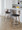 Cosi counter stool in Light Grey Wood, Black PU, Black Metal, close-up detail, featuring swivel and wood frame
