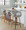 Curvo counter stool in Walnut Wood, Light Grey PU, Black Metal, featuring swivel and wood frame