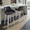 Daniella 26" Contemporary Fixed-Height Counter Stool with Swivel in White Wood and Black Faux Leather with Round Chrome Footrest- Set of 2 — lifestyle photo 1