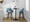 Fabrico 26" Mid-Century Modern Fixed-Height Counter Stool in Walnut Glazed Wood and Blue Noise Fabric with Round Black Metal Footrest- Set of 2 — lifestyle photo 1
