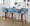 Fabrico 26" Mid-Century Modern Fixed-Height Counter Stool with Swivel in Walnut Wood and Blue Noise Fabric with Round Black Metal Footrest- Set of 3 — lifestyle photo 4