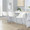 Fran 26" Contemporary Fixed-Height Counter Stool in Silver Metal and White Faux Leather- Set of 2 — lifestyle photo 1