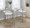 Fuji 26" Contemporary Stackable Counter Stool in Brushed Stainless Steel with White Faux Leather- Set of 3 — lifestyle photo 3