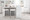 Fuji 26" Contemporary Stackable Counter Stool in Brushed Stainless Steel with White Faux Leather- Set of 3 — lifestyle photo 6