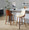 Gianna counter stool in Walnut Wood, Cream PU, Black Metal, featuring swivel