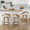 Grotto 26" Fixed-Height Counter Stool with Swivel in Whitewashed Wood and Oat Fabric with Round Black Metal Footrest- Set of 2 — lifestyle photo 1