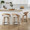 Grotto 26" Fixed-Height Counter Stool with Swivel in Whitewashed Wood and Oat Fabric with Round Black Metal Footrest- Set of 2 — lifestyle photo 2