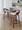Grotto counter stool in Walnut Wood, Black Metal, Cream PU, featuring swivel and wood frame