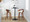 Grotto counter stool in Walnut Wood, Black Metal, Cream PU, featuring swivel and wood frame