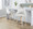 Hannah 26" Transitional Fixed-Height Counter Stool with Swivel in Whitewashed Wood and Cream Fabric with Round Black Metal Footrest- Set of 2 — lifestyle photo 1