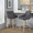 Hannah 26" Transitional Fixed-Height Counter Stool with Swivel in Whitewashed Wood and Dark Grey Faux Leather with Round Black Metal Footrest- Set of 2 — lifestyle photo 1