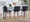 Henry 26" Contemporary Fixed-Height Counter Stool with Swivel in Walnut Wood and Black Faux Leather with Round Chrome Footrest- Set of 2 — lifestyle photo 3