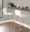 Mara counter stool in Gold Metal, White PU, featuring metal footrest