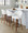 Matisse counter stool in Walnut Wood, Cream Fabric, Black Metal, featuring swivel and wood frame
