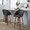 Matisse High Back 26" Contemporary Fixed-Height Counter Stool with Swivel in Walnut Wood and Black Faux Leather with Round Black Metal Footrest- Set of 2 — lifestyle photo 1