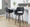 Mustang 26" Contemporary Fixed-Height Counter Stool with Swivel in Walnut Glazed Wood and Black Faux Leather with Round Black Metal Footrest- Set of 2 — lifestyle photo 1