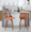 Trevi counter stool in Walnut Wood, Orange Fabric, Black Metal, featuring fabric design