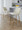 Toriano 26" Contemporary Fixed-Height Counter Stool with Swivel in Cream Fabric and Gold Metal with Round Footrest- Set of 2 — lifestyle photo 2