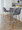 Toriano 26" Contemporary Fixed-Height Counter Stool with Swivel in Grey Fabric and Gold Metal with Round Footrest- Set of 2 — lifestyle photo 1