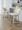 Toriano 26" Contemporary Fixed-Height Counter Stool with Swivel in Whitewashed Wood and Cream Fabric with Round Black Metal Footrest- Set of 2 — lifestyle photo 1