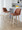 Toriano 26" Contemporary Fixed-Height Counter Stool with Swivel in Whitewashed Wood and Camel Faux Leather with Round Chrome Metal Footrest- Set of 2 — lifestyle photo 2