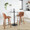 Tintori counter stool in Walnut Wood, Camel PU, Black Steel, featuring swivel and metal footrest