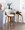 Vintage Mod 26" Mid-Century Modern Fixed-Height Counter Stool with Swivel in Walnut Wood and Cream Fabric with Round Chrome Metal Footrest- Set of 2 — lifestyle photo 1