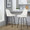 Studded Marcel 27" Contemporary Fixed-Height Counter Stool with Swivel in Black Metal and White Faux Leather with Gold Nailhead Trim and Round Gold Metal Footrest- Set of 2 — lifestyle photo 2