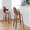 Ariana bar stool in Walnut Wood, Beige Fabric, Black Metal, featuring swivel and upholstered seat