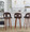Ava Upholstered 30" Contemporary Fixed-Height Barstool with Swivel in Walnut Wood and Espresso Velvet with Round Chrome Metal Footrest- Set of 2 — lifestyle photo 1