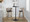 Cosi bar stool in Light Grey Wood, Black Metal, Black PU, close-up detail, featuring swivel and wood frame