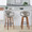 Curvo bar stool in Walnut Wood, Light Grey PU, Black Metal, featuring swivel and wood frame
